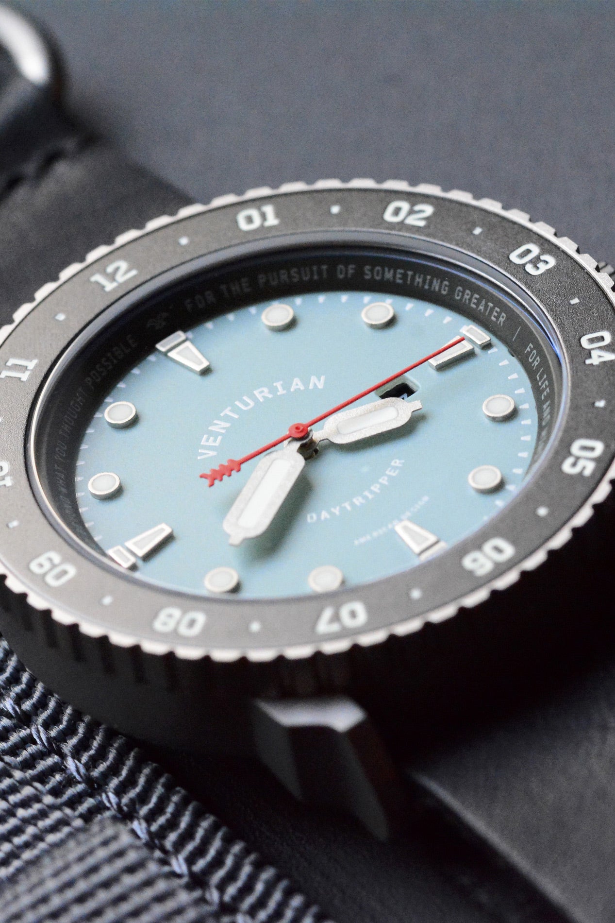 Venturian WatchWorks blue dial Daytripper 38mm solar titanium mens watch. Comes on a leather watch strap.