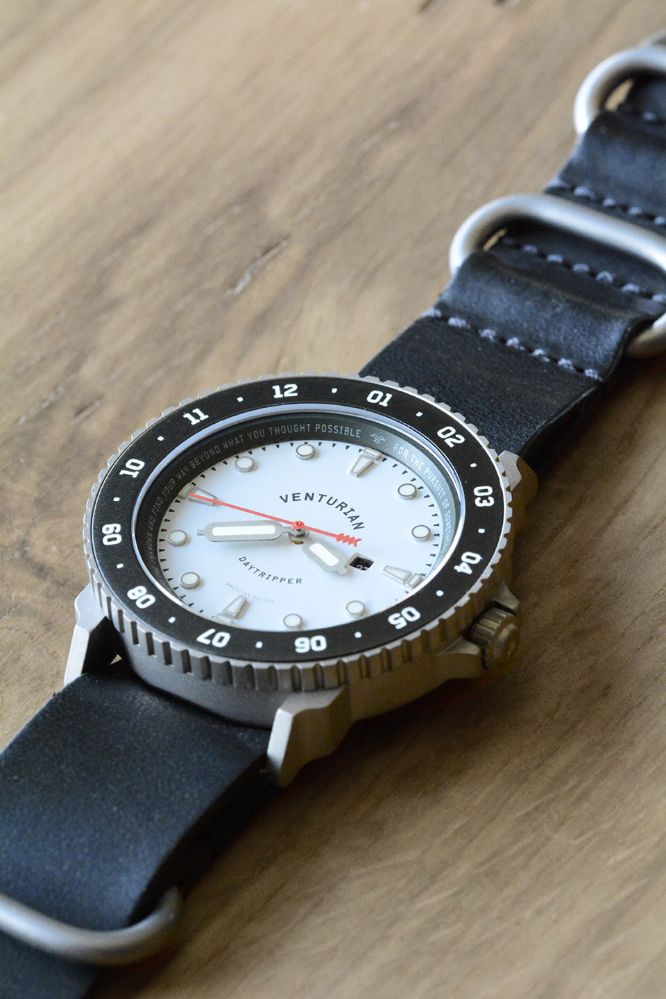 Venturian WatchWorks Daytripper mens watch — 38mm dual timer bezel on wood.