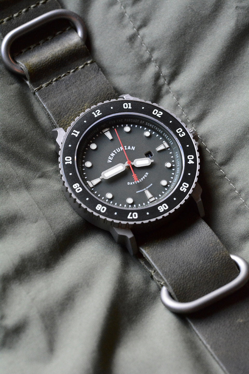 Venturian WatchWorks Daytripper mens watch — 38mm dual timer bezel — black dial with olive green horween leather watch strap.