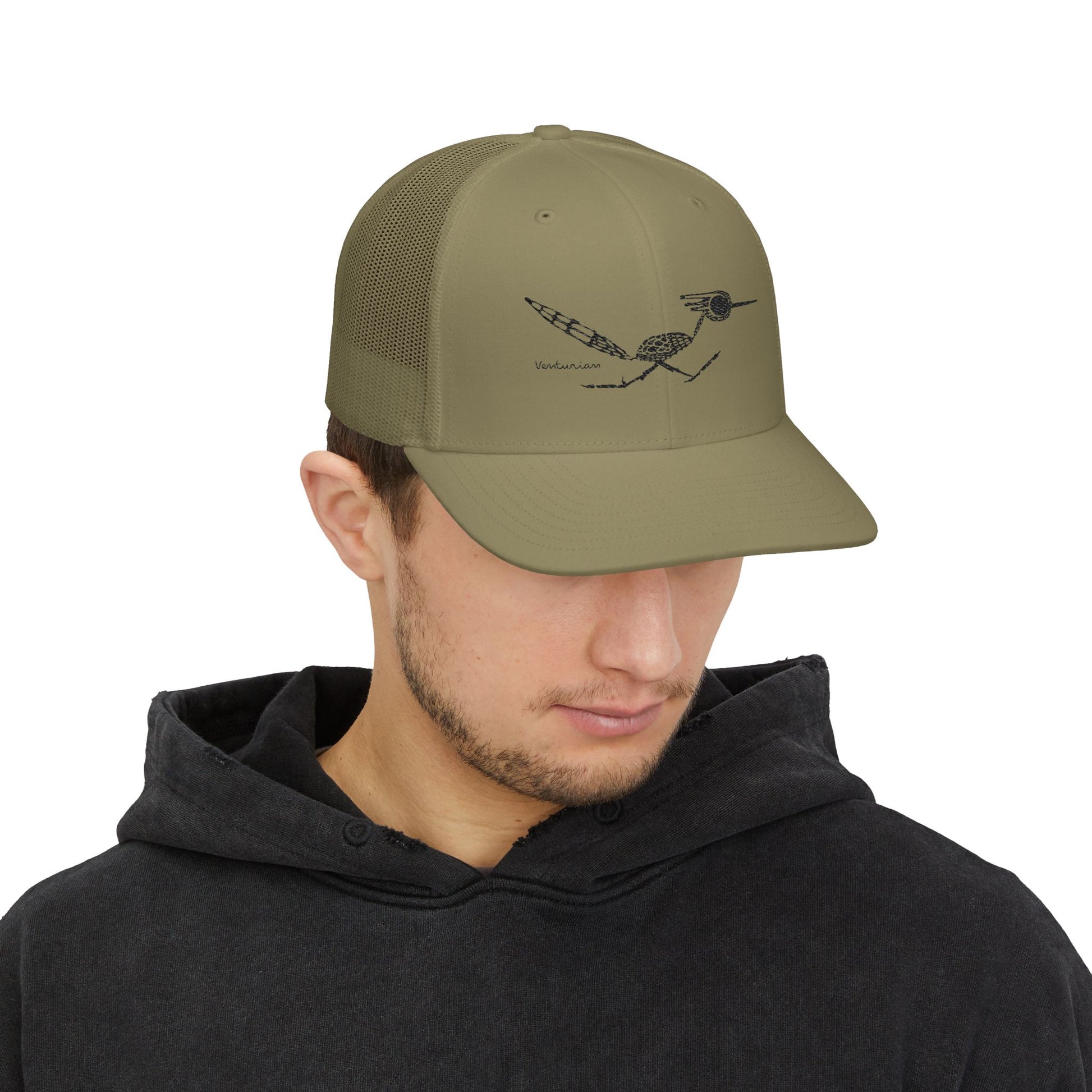 Man wearing a green cap with a logo on a white background.
