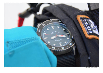 venturian daytripper watch between a winter glove and blue jacket