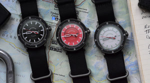 Venturian Wildsider 38MM solar titanium compass watch in black, red, and white.
