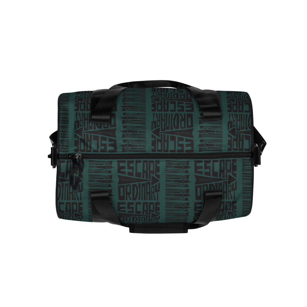 Green and black duffel bag with patterned design on a white background
