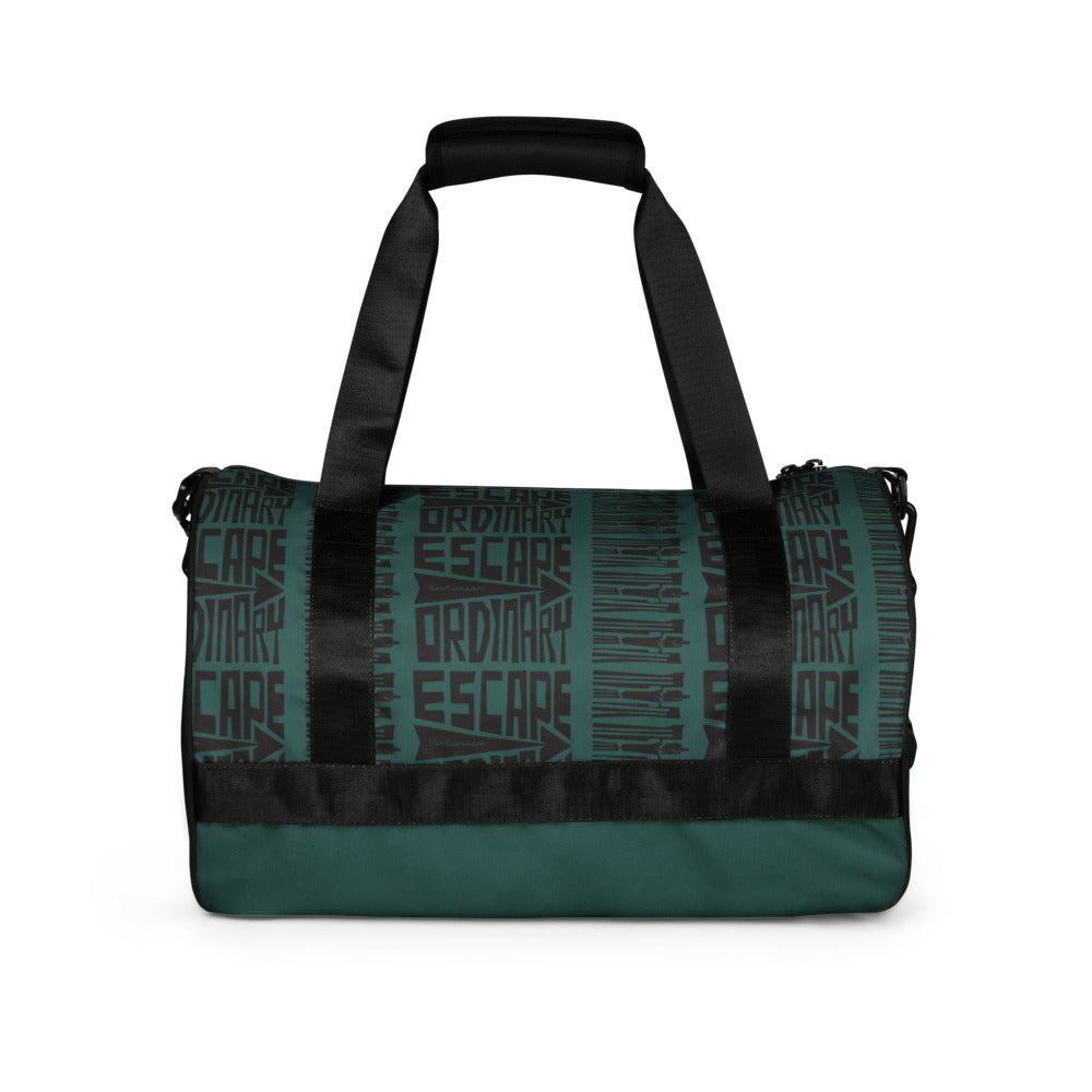 Teal and black duffel bag with 'Ordinary Escape' text on a white background