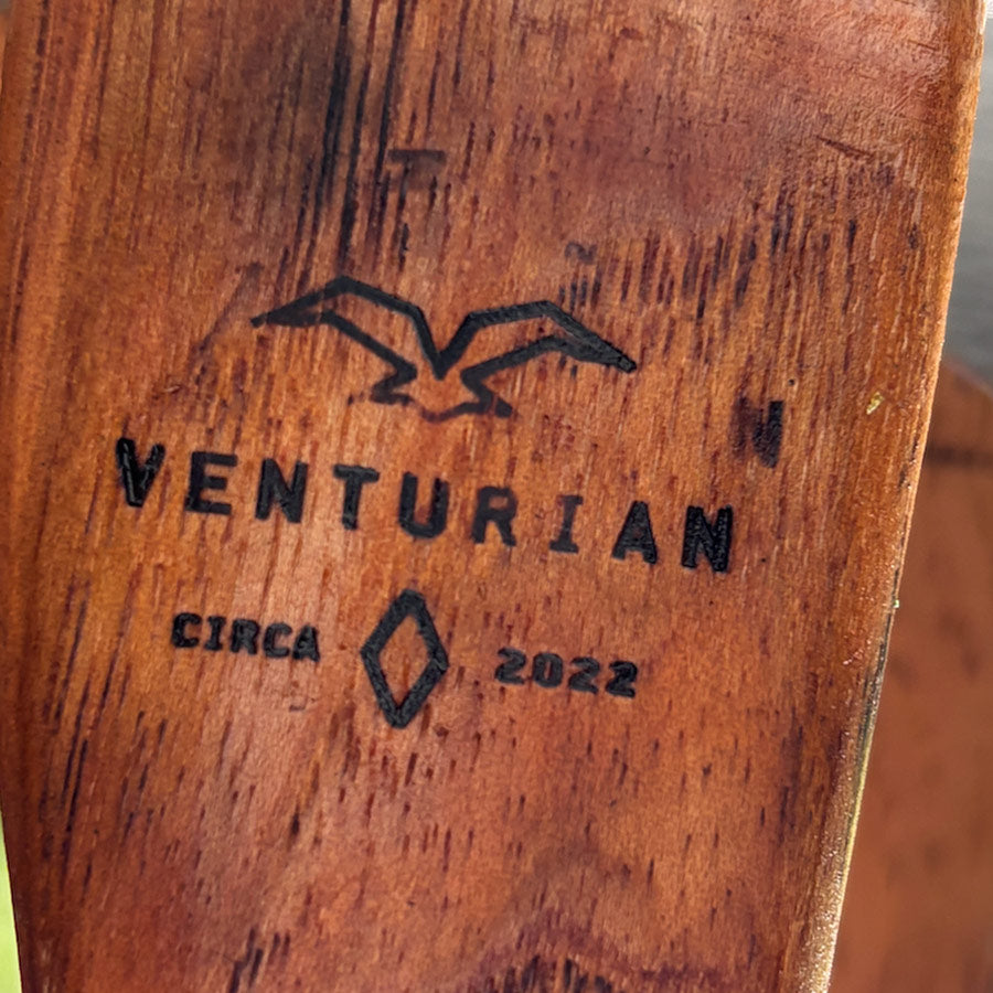 Wooden surface with 'Venturian' branding and 'Circa 2022' text.