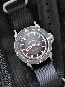 The Venturian Wildsider 38MM Solar Titanium compass tool watch in Black on backpack