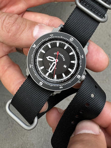 The Venturian Wildsider 38MM Solar Titanium compass tool watch in Black in hand