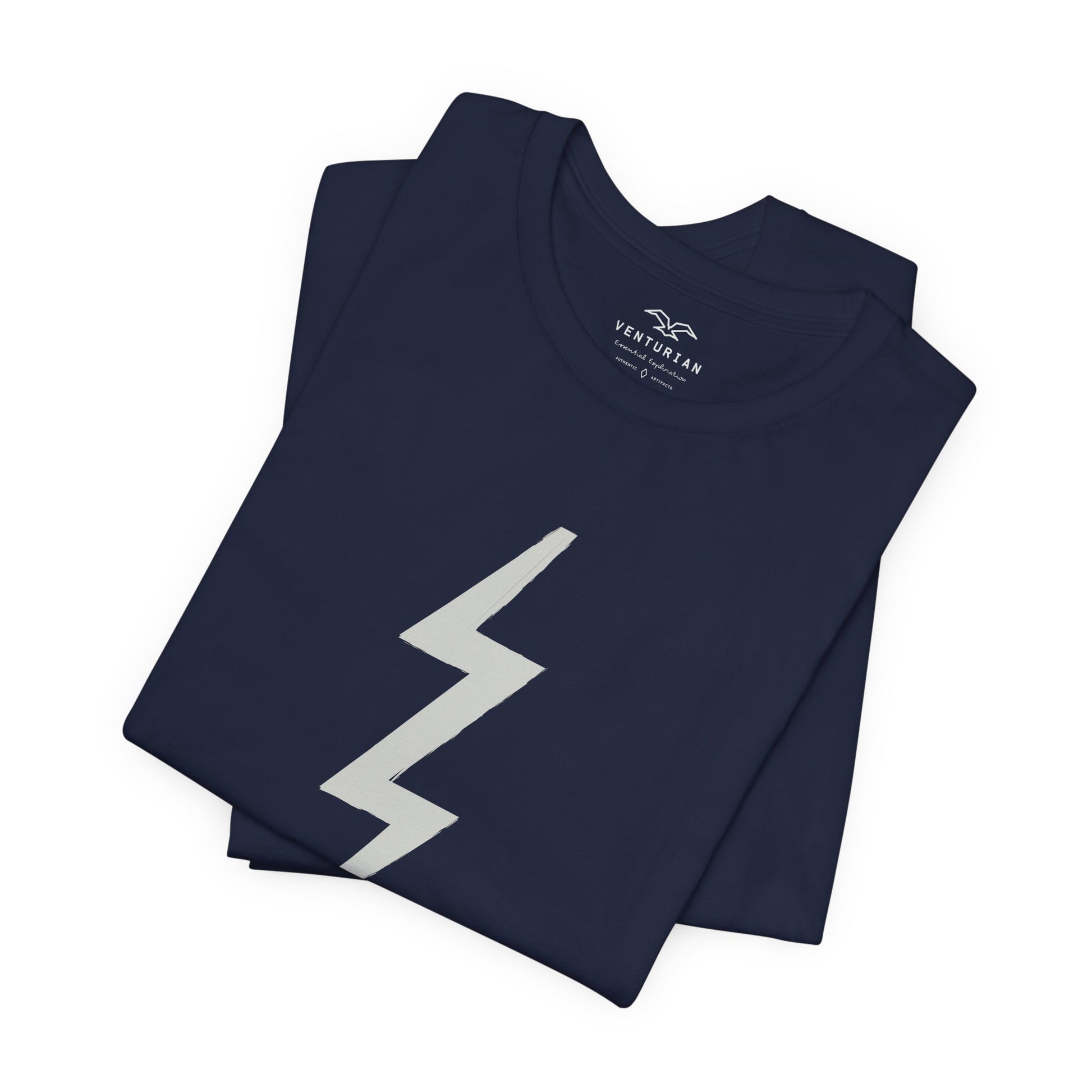 Folded navy blue t-shirt with a white lightning bolt design on a white background