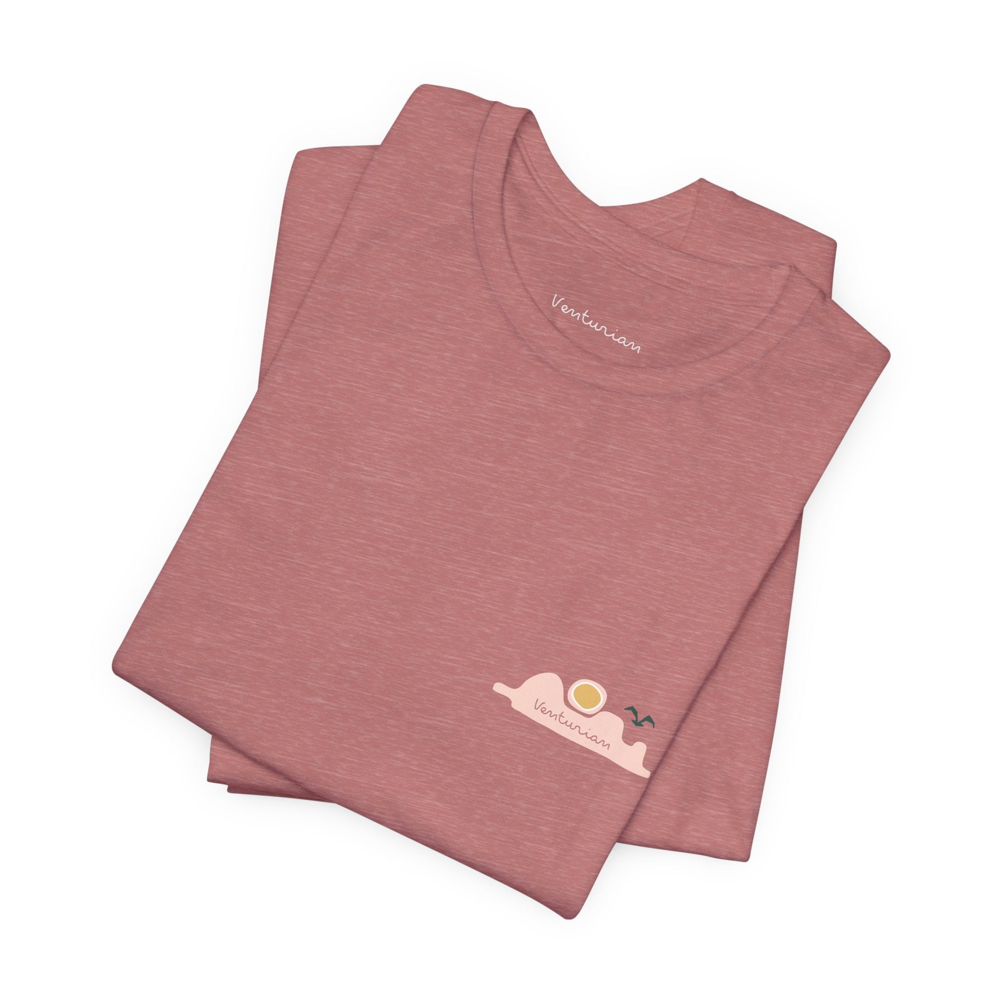Stack of pink t-shirts with a logo on a white background