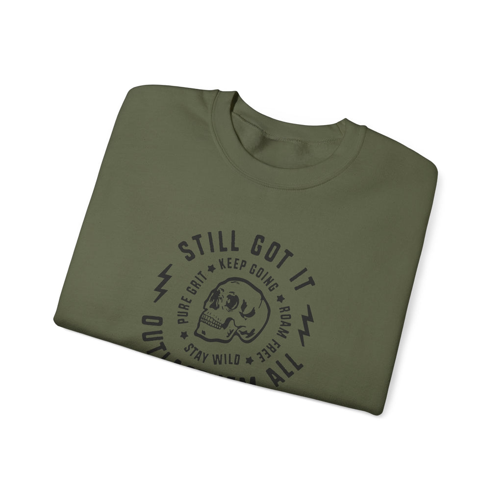 Folded green t-shirt with black text and graphics on a white background