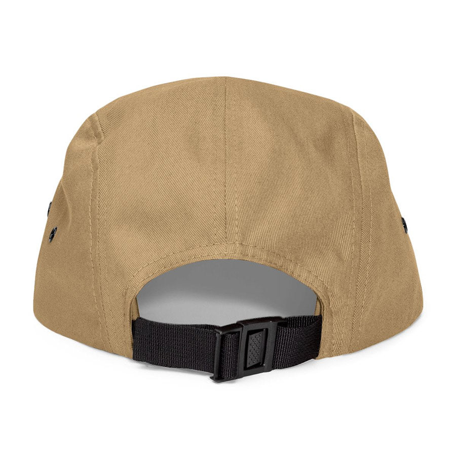 Beige cap with black strap on a white background